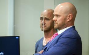 Joseph David Emerson, left, 44, is arraigned in Multnomah County Circuit Court, Oct. 24, 2023, in Portland, Ore. Three passengers sued Alaska Airlines on Thursday, Nov. 2, saying they suffered emotional distress from an incident last month in which Emerson, an off-duty pilot, was accused of trying to shut down the engines of a flight from Washington state to San Francisco.