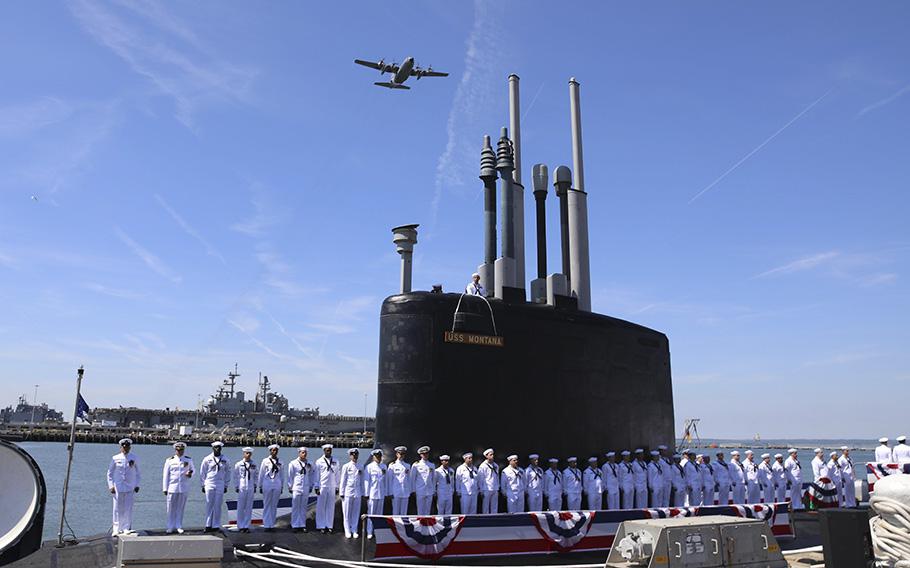 Crewmembers attached to the Virginia-class fast attack submarine USS Montana (SSN 794) man the ship during a commissioning ceremony in Norfolk, Va., June 25, 2022.