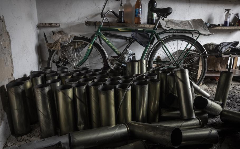 Used 105mm shell casings are stacked in a civilian garage on the outskirts of Chasiv Yar in the Donetsk region of Ukraine on April 21, 2023. 