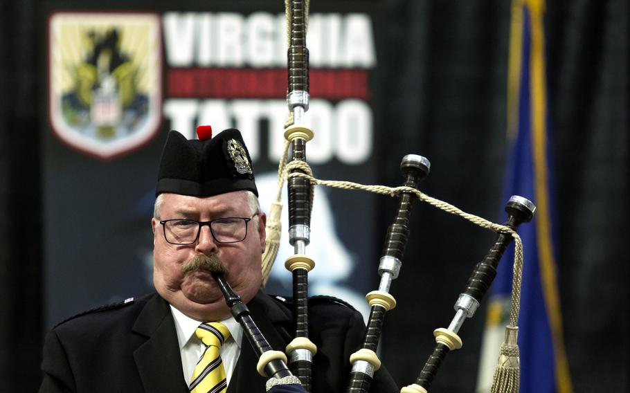 A man playing with other members of the Tidewater Pipes and Drums