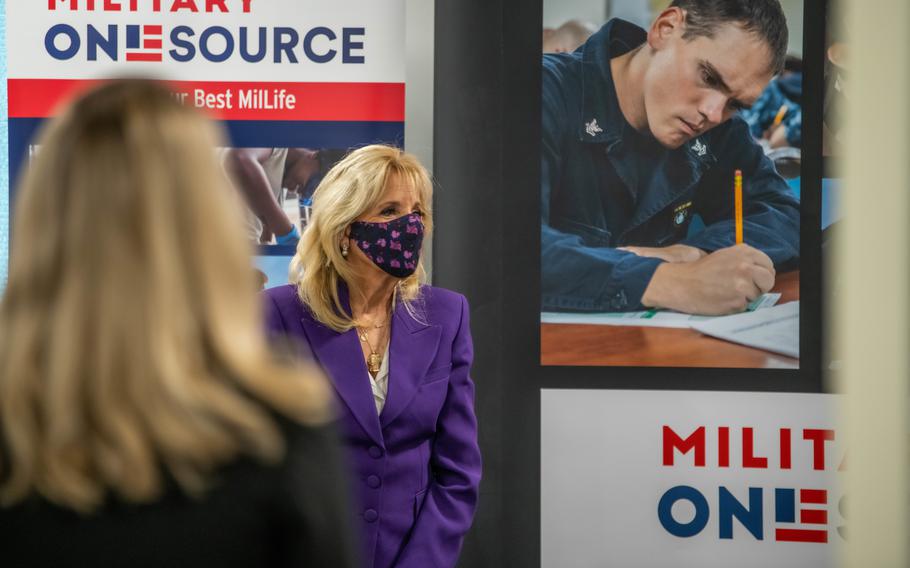 First lady Jill Biden listens to a facilitator from Military OneSource during a facility tour with Charlene Austin and Hollyanne Milley, in Arlington, Va., April 7, 2021.