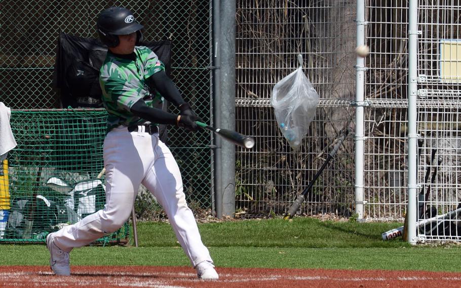 Kubasaki's Skylar Waltz conneects for a two-run home run in Saturday's 5-4 loss at Americaqn School In Japan.