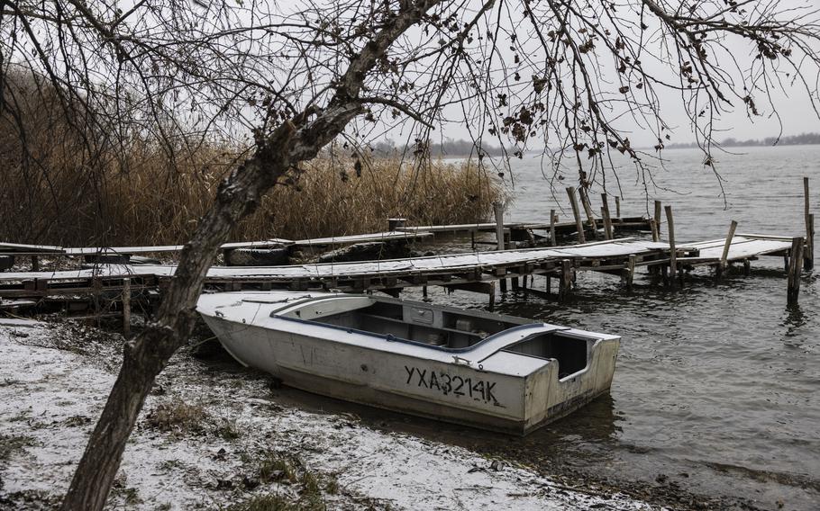 The small motorboat carrying Tetiana Svitlova and her husband, Vladyslav Svitlov, was hit by gunfire Sunday as they crossed the Dnieper River while trying to flee the Russian-occupied island where they lived. Svitlova, 75, was struck and died. 