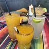 Mexican Pink in Kaiserslautern, Germany, has a variety of tequila- and mezcal-based cocktails. The offerings include classics like palomas and margaritas and more inventive offerings like the black rock, a beverage made with fruit juices and activated charcoal. Pictured, center, is the spicy mezcalita, made with mezcal, lime juice, mango juice and chili powder. 