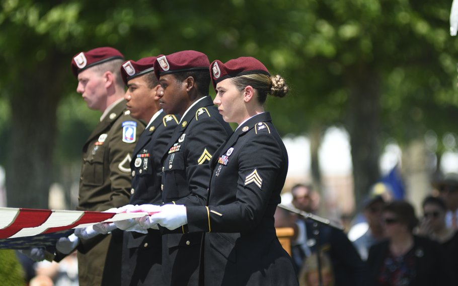 Military casket bearers hold an American flag over the casket of the unknown American soldier from World War I at the Oise-Aisne American Cemetery in Seringes-et-Nesles, France, on Wednesday, June 7, 2023. They folded the flag a few minutes later, and it was given to the mayor of the French town where the remains were found in early 2022. 