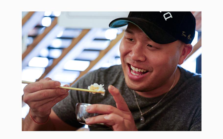 Vu Ly, founder of Asian Grub in DFDUB (DFW) Facebook group, reacts while working on a meal at a restaurant at Koreatown, on Wednesday, April 17, 2024, in Carrollton. The group started off highlighting the advocacy and community that rose up following the rise of anti-Asian hate incidents during the coronavirus pandemic.
