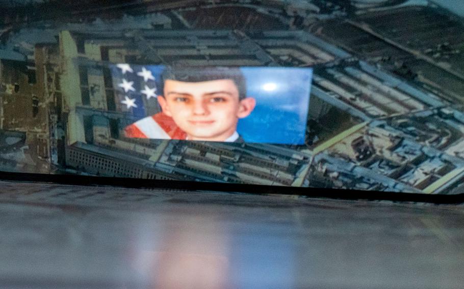 This photo illustration created on April 13, 2023, shows the suspect, national guardsman Jack Teixeira, reflected in an image of the Pentagon in Washington, D.C. FBI agents arrested a young national guardsman suspected of being behind a major leak of sensitive US government secrets -- including about the Ukraine war. 