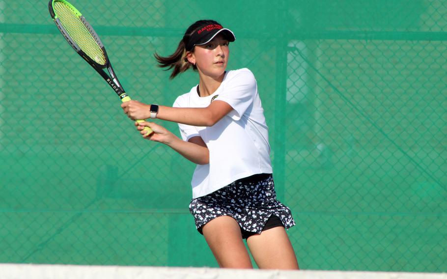 Humphreys' Anna Reynolds hits a two-hand backhand return against Yongsan International-Seoul's Emily Song during Wednesday's Korea tennis matches. Song won 8-3.