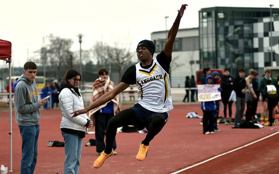Ansbach's Okenie McLaughlin flies in the air during the boys long jump at a track and field meet on March 14, 2025, at Kaiserslautern High School in Kaiserslautern, Germany.