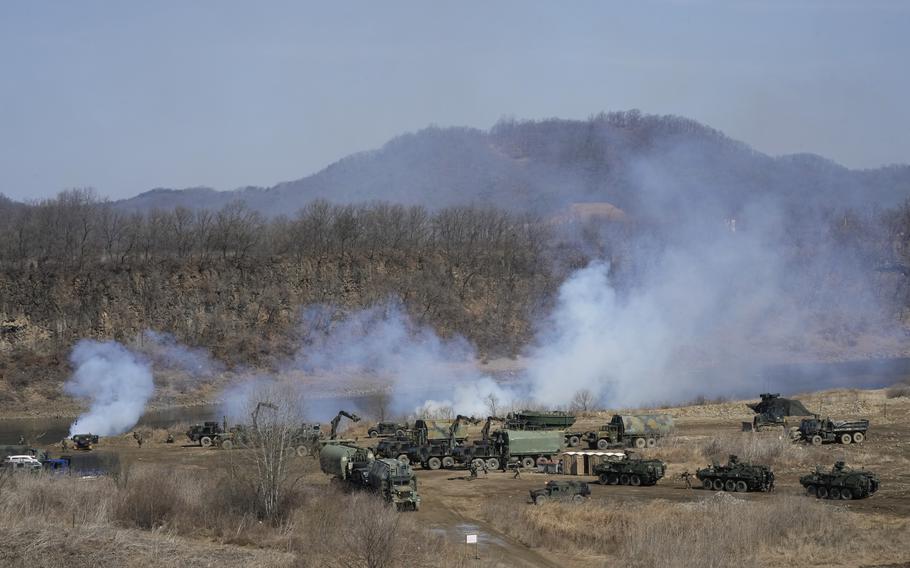 U.S. Army armored vehicles prepare to cross the Hantan river at a training field in Yeoncheon, near the border with North Korea, Monday, March 13, 2023. The South Korean and U.S. militaries launched their biggest joint military exercises in years Monday, as North Korea said it conducted submarine-launched cruise missile tests in apparent protest of the drills it views as an invasion rehearsal. 