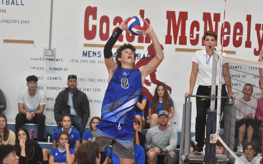 Rota’s Tyler DeMeritt tosses the ball over the net towards Aviano on Saturday, Oct. 14, 2023, in the Saints’ four-set victory over the Admirals.