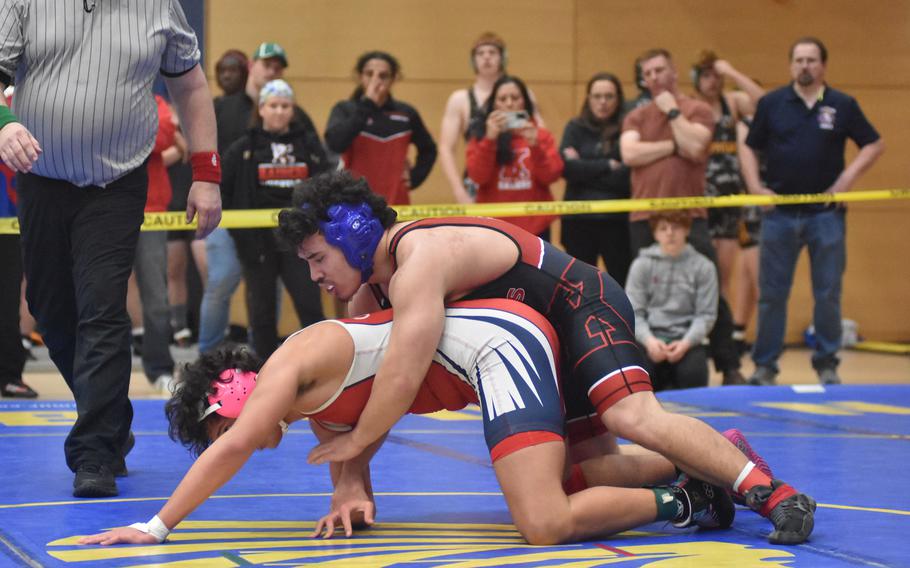 Kaiserslautern’s Freeman Allen rides Aviano’s Tyler Mellon at 175 pounds Friday, Feb. 9, 2024, at the DODEA European Wrestling Championships in Wiesbaden, Germany.