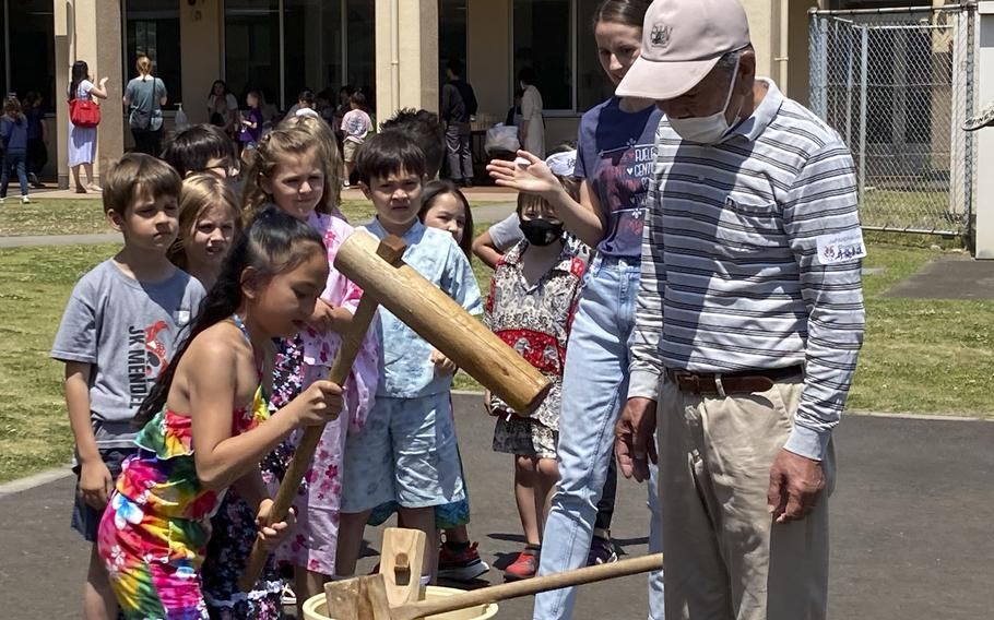 Japanese volunteers show students how to make mochi during the JaPANDAsia event at Joan K. Mendel Elementary School on Yokota Air Base, Japan, Thurdsay, May 4, 2023.