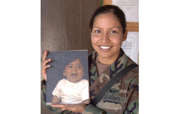 Eagle Base, Bosnia and Herzegovina, May 6, 2002: Sgt. Michelle Flores writes letters often to her son, Emilio. At 14-months, the boy is too young to read them, but some day he'll know his mother was 
thinking of him while she was deployed to Bosnia and Herzegovina.

Happy Mothers' Day to all military moms and a bit of extra love to those deployed and away from their children this Mothers' Day -- as Sgt. Flores was back in 2002. Read how the Sergeant, and other mom's deployed at Eagle Base dealt with the separation here. 

META TAGS: Mothers' Day; military family; women in the military