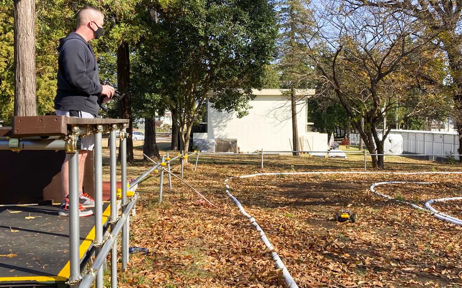 Chief Warrant Officer 4 Garrett Burns races his radio-controlled buggy on a new track at the Sagamihara Housing Area near Camp Zama, Japan, Dec. 9, 2021.