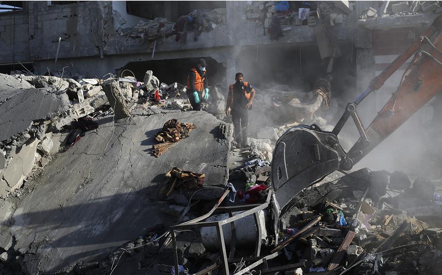 Palestinians search for survivors outside a morgue in Rafah after the Israeli bombardment of the Gaza Strip on Dec. 19.