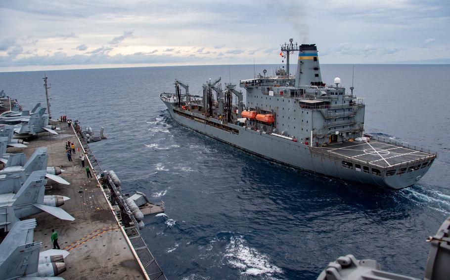 The USS Ronald Reagan (CVN 76) approaches the Military Sealift Command fleet replenishment oiler USNS Tippecanoe (T-AO 199) to conduct a fueling-at-sea, Wednesday, July 27, 2022. The USS Ronald Reagan and strike group have entered the South China Sea as part of what the 7th Fleet said was a scheduled operation amid rising tensions with China over a potential Taiwan visit by House Speaker Nancy Pelosi.