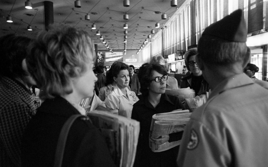 A group of Red Cross registered nurses and volunteers arrive at Yokota Air Base