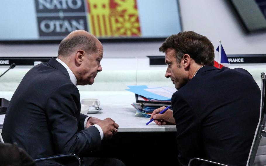 Olaf Scholz, Germany's chancellor, and Emmanuel Macron, France's president, at a meeting on day two of the NATO summit in Madrid on June 29, 2022. 