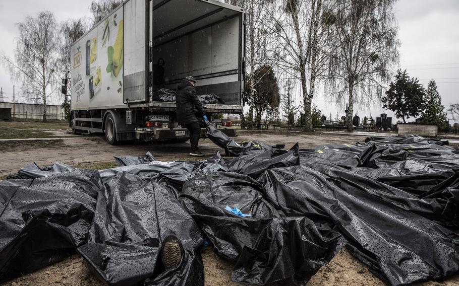 Volunteers gather the civilian corpses that have been found all over the city of Bucha, Ukraine, on April 10, 2022.