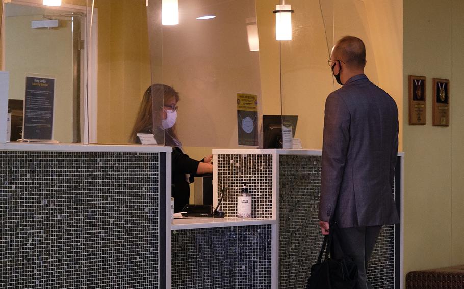 A customer checks into the Navy Lodge at Yokosuka Naval Base, Japan, Wednesday, June 9, 2021.