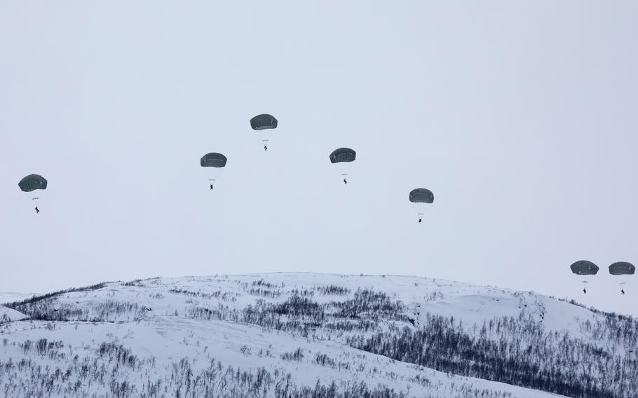 Soldiers from the U.S. Army's 11th Airborne Division descend into the Norwegian Arctic on March 18, 2024, near Bardufoss. The jump was part of NATO's exercise Arctic Shock.