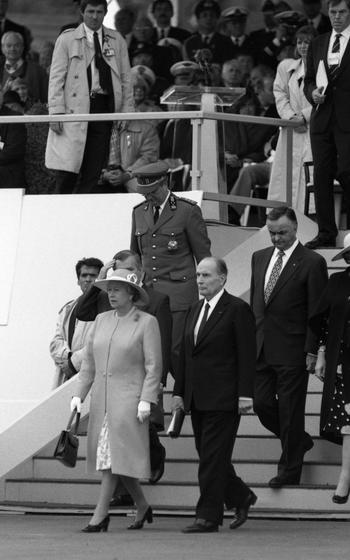 Great Britain’s Queen Elizabeth II and French President Francois Mitterrand at D-Day ceremonies marking the 50th anniversary on Omaha Beach in Colleville-sur-Mer, Monday, June 6, 1994. Visible behind the heads of state are (left to right) King Albert II of Belgium, Ray Hnatyshyn, Governor General of Canada, and Queen Beatrix of the Netherlands.