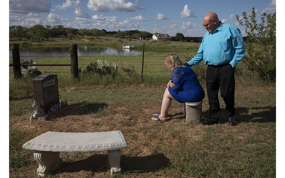 After Pastor Frank Pomeroy’s final service, he and his wife, Sherri, visit the grave of their daughter, Annabelle, who was killed in the shooting at 14.