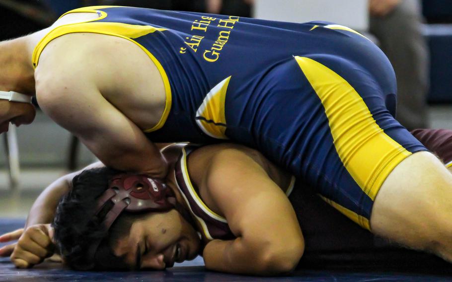 Guam High's Michael Bopp uses a power half on Father Duenas Memorial's Ryan Gofigan at 171 pounds during Saturday's Guam wrestling dual meets. Bopp won by 6-2 decision over Gofigan.