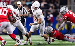 Texas back up quarterback Arch Manning (16) rushes for a first down in the second quarter of the College Football Playoff semifinal game against Ohio State at AT&T Stadium in Arlington, Texas, on Friday, Jan. 10, 2025. (Chris Torres/Fort Worth Star-Telegram/TNS)