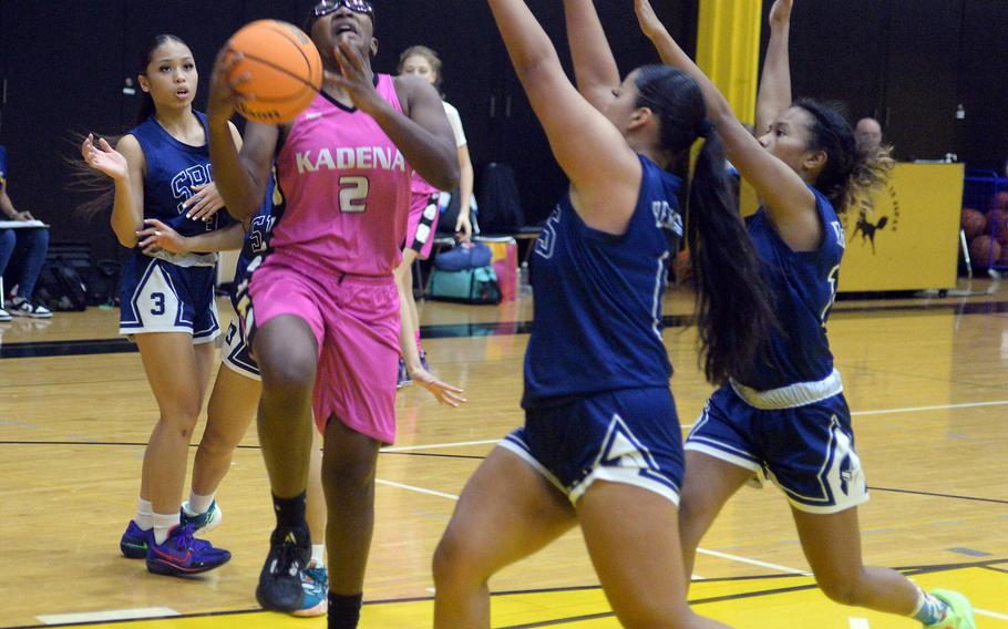 Kadena's Destiny Richardson drives against St. Paul Christian's defense during Satuday's girls championship game in the 5th American School In Japan Kanto Classic basketball tournament. The Warriors outalsted the Panthers 38-33.