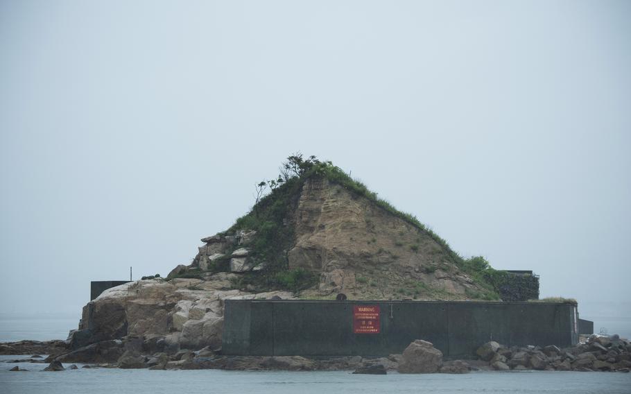 Teams practice explosive ordnance disposal on Target Island, a restricted area five miles from Marine Corps Air Station Iwakuni, Japan. 