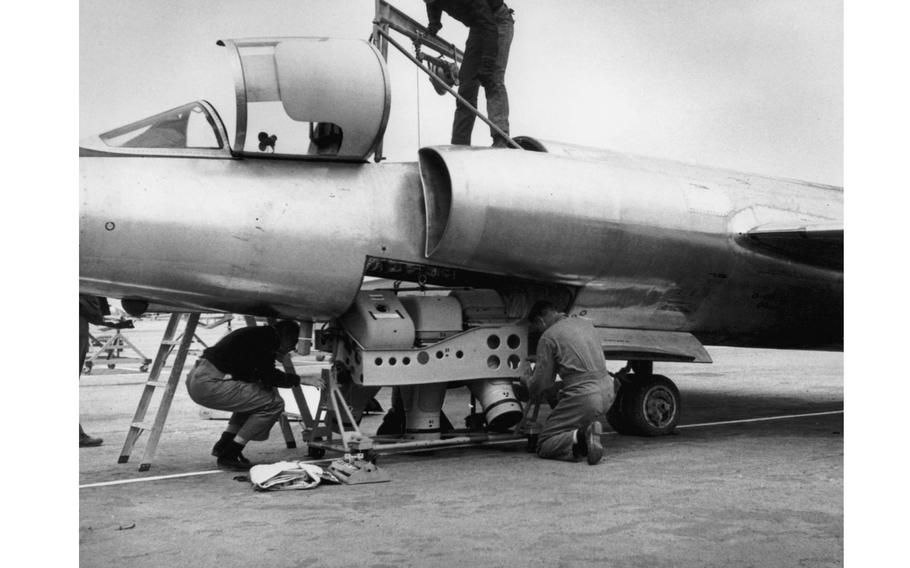 Technicians load a type A-2 camera set into a U-2’s equipment bay or “Q-bay.” 