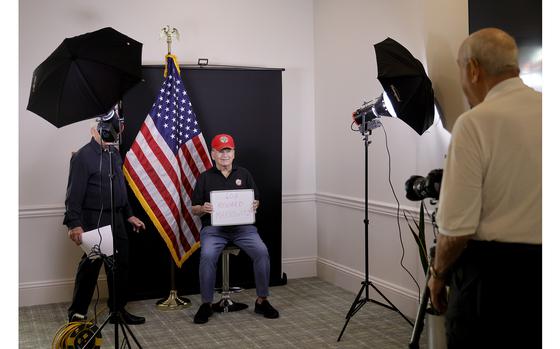 Honor Portraits photographer Bill Rosenberg photographs veteran Howard Markowitz, 87, of Delray Beach, at the Carlisle Residences in Lantana on Nov. 1, 2023. 