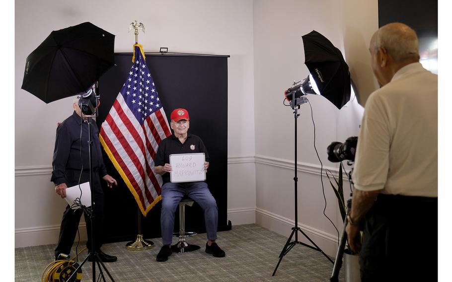 Honor Portraits photographer Bill Rosenberg photographs veteran Howard Markowitz, 87, of Delray Beach, at the Carlisle Residences in Lantana on Nov. 1, 2023. 