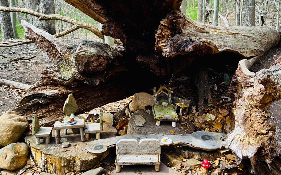 One of Therese Ojibway’s fairy houses is tucked inside a hollowed log along the South Mountain Fairy Trail in Millburn, N.J. She and volunteers also have used root systems. 
