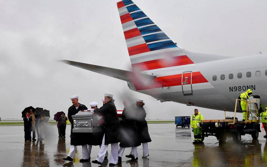 The remains of Seaman 1st Class Wilbur F. Newton are returned to Missouri. A U.S. Navy Reserve Honor Guard carried Newton’s remains to a hearse, which was then escorted to his hometown of Mound City, where he will be buried.