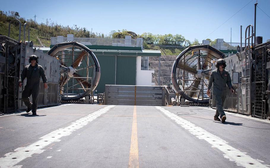 Sailors complete an inspection on a landing craft air cushion, or LCAC, at Sasebo Naval Base in Japan in April 2018.