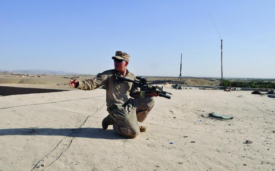 Lance Cpl. Miguel Delacruz sets up watch on top of a building at Patrol Base Cuba, the Afghan National Security Forces' home base during the fight for Sangin District. The valley has seen attacks ramp up as the Taliban has chosen to swing its assets there for a significant offensive.