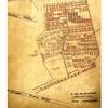 A sepia-toned map with black and red markings sketching out the layout of a camp and cemetery.