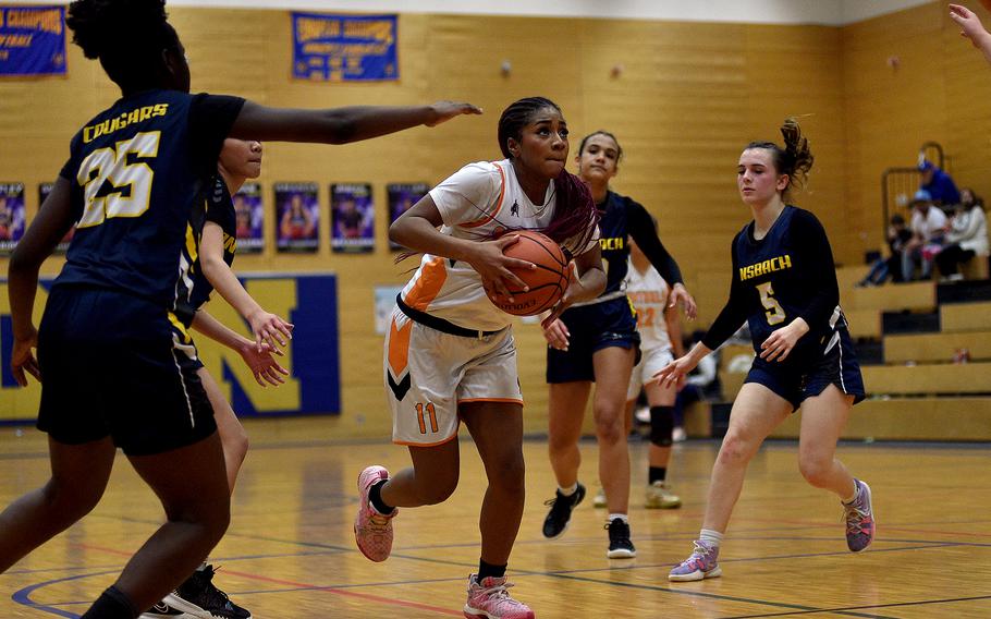 Spangdahlem forward Gabrielle Schmidt drives to the basket during a Division III semifinal against Ansbach at the DODEA European Basketball Championships on Feb. 16, 2024, at Wiesbaden High School in Wiesbaden, Germany.