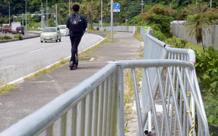 Fence damage from a fatal collision is seen outside Camp Foster, Okinawa, May 10, 2022.