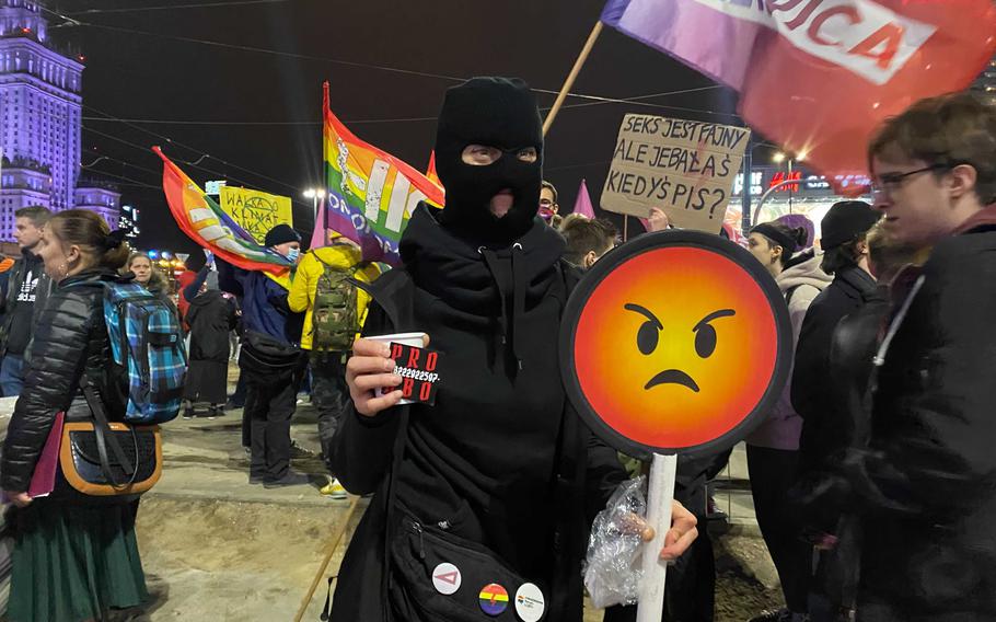 A demonstrator holds an angry emoji sign at a protest demanding rights to abortions in Warsaw on Oct. 22. 