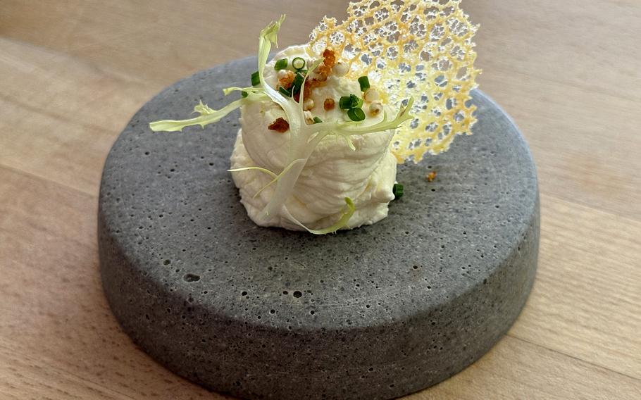 Whipped ricotta with a parmesan crisp and chives at Vicino in Kasierslautern, Germany.