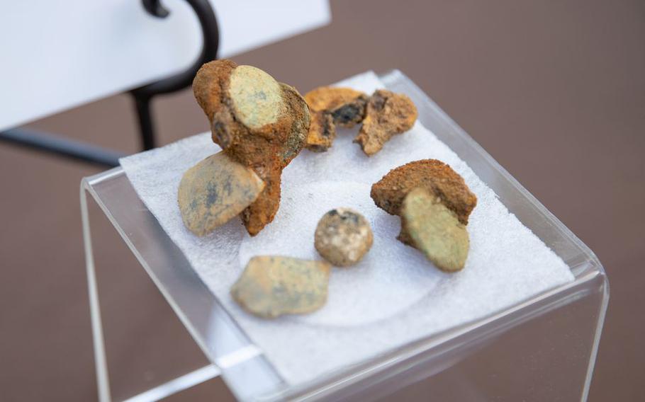 Small items found at a Rowan University archaeological dig site on display in National Park, N.J., on Tuesday, Aug. 2, 2022. Archaeologists discovered 13 sets of remains of possible Hessian soldiers from the 1777 Battle of Red Bank.