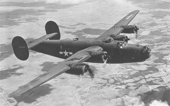A black and white photo of a WWII bomber.