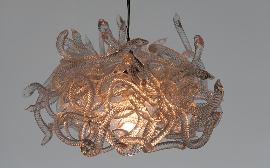 A glass chandelier resembling snakes.