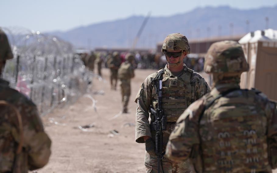 Members of the Operation Lone Star Task Force West and Texas Tactical Border Force block migrants from illegally entering Texas, near El Paso. Units assumed blocking positions behind previously installed concertina wire in preparation for the expiration of Title 42.