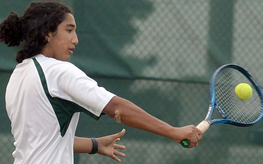 Kubasaki's Jaden Oshana hits a backhand during Wednesday's Okinawa tennis doubles tournament. Oshana and teammate Owen Ruksc beat Kubasaki's Canaan Jones and Cael Perry 9-8 (7-3) to take second place in the tournament; Jones and Perry finished third.
