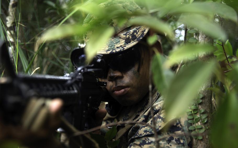 Cpl. Ray Pineda, a rifleman with 3rd Battalion, 3rd Marine Regiment, engages the enemy during a jungle warfare exercise at Okinawa’s Northern Training Area, May 26, 2021. 